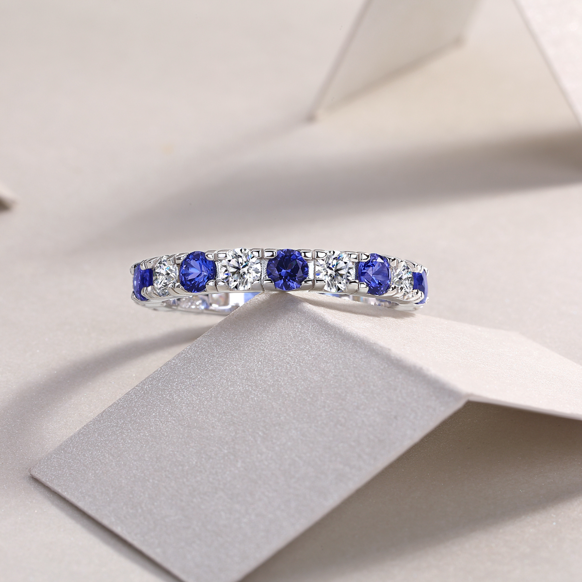 2.4g Sterling Silver Platinum Plated Ring Synthetic Blue Sapphire & White Stone
