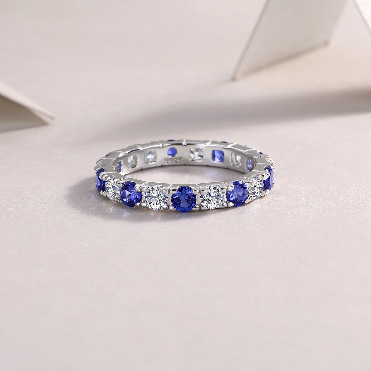 2.4g Sterling Silver Platinum Plated Ring Synthetic Blue Sapphire & White Stone