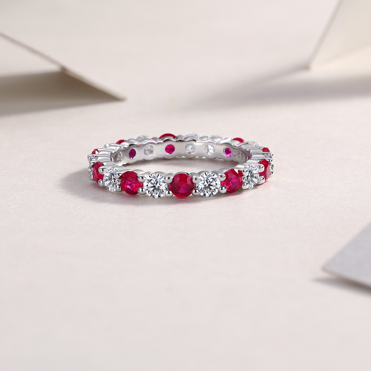 2.4g Sterling Silver Platinum Plated Ring Synthetic Ruby & White Stone Alternating