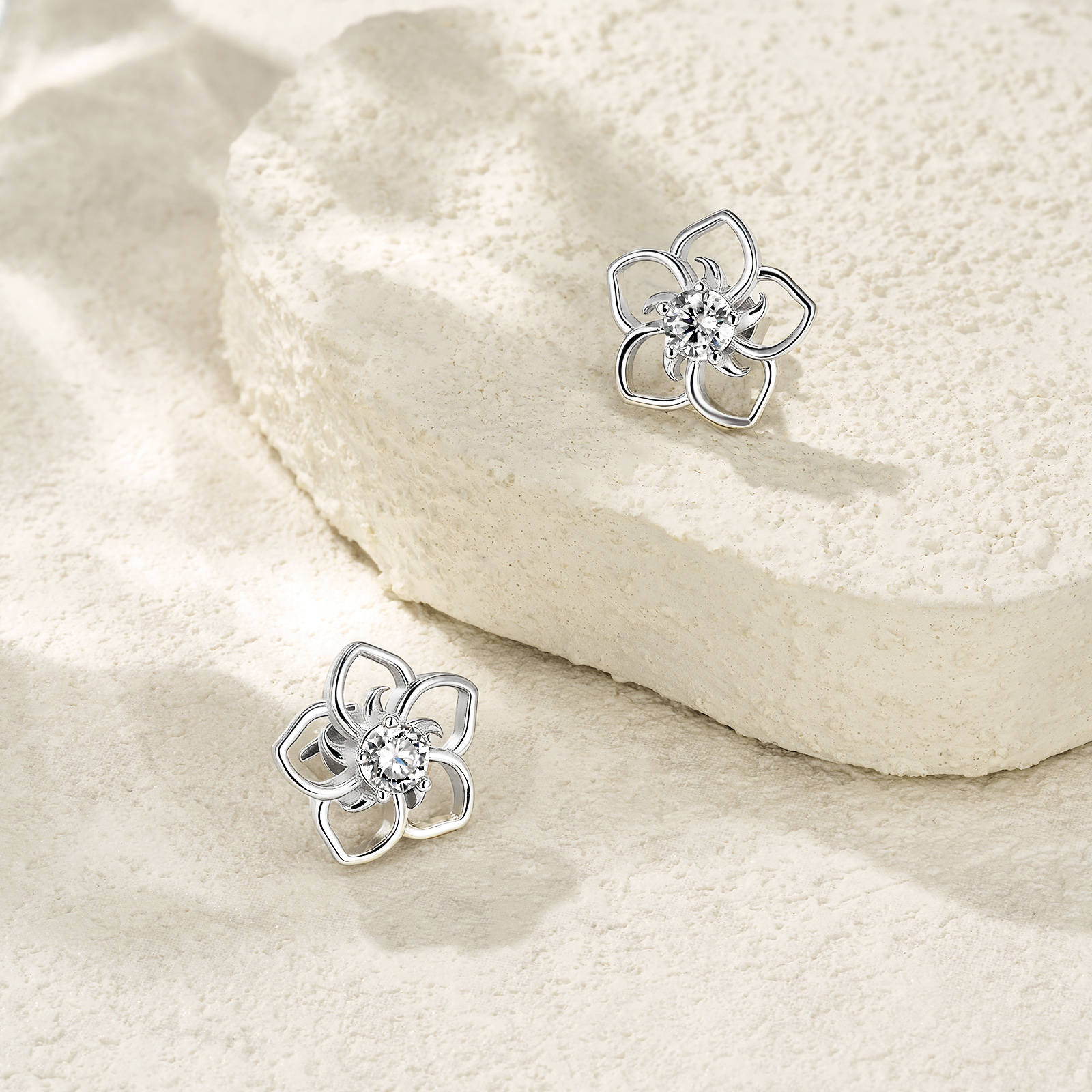 Sterling Silver Abstract Flower Stud Earrings, 0.5ct D-VVS1 Moissanite, Platinum Plated