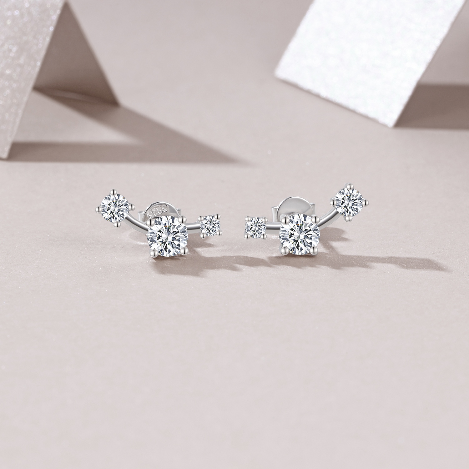 Sterling Silver Three-Stone Curved Stud Earrings, 0.5ct D-VVS1 Moissanite, Platinum Plated